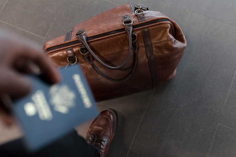 passport and suitcase travel packing tips