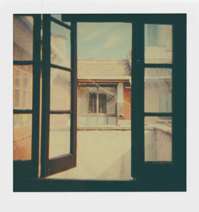 polaroid photo of glass door